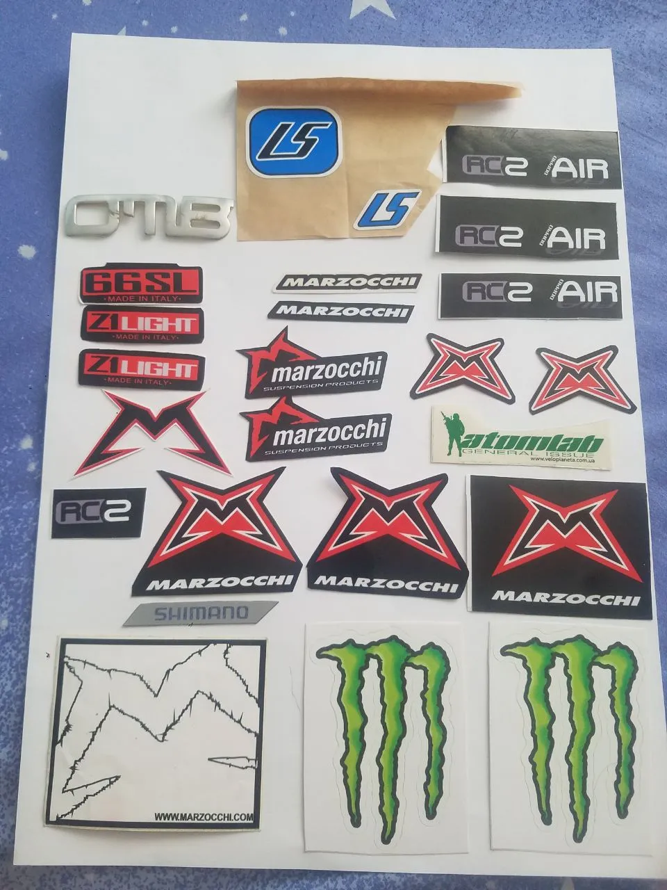 Наклейки + Пружина + Каретка + Сумка + Годинник Marzocchi та Monster Energy фото 1