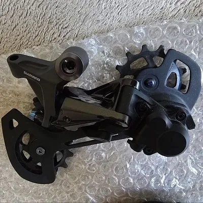 Перемикач та манетка Shimano Deore XT 12-speed