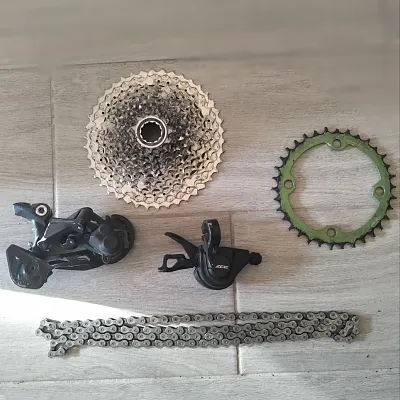 Трансмісія Shimano Deore 10-speed + ручка передня Shimano Deore та гідролінія