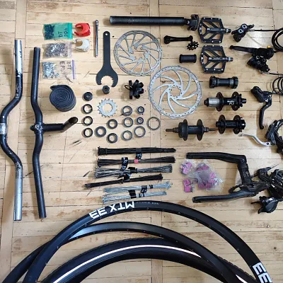 Ободи + втулки + покришка + гальма + зірки + шатуни + педалі + перекидка та ін.